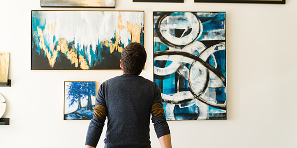 Back-view of individual viewing an art installation.